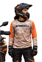 Load image into Gallery viewer, Desert Ranger Men's Riding Jersey in digital desert camouflage with bold orange sleeves and SPYNDELL branding, worn by an adventure motorcycle rider.