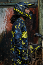 Load image into Gallery viewer, Neon Grunge Men's Riding Jersey side view showing its dark navy base with neon yellow and blue grunge graphics, styled for motocross riding.