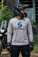 Load image into Gallery viewer, Sandstorm Elite Men's Riding Jersey in sand camouflage with bold orange-red sleeves and SPYNDELL branding, worn by an adventure motorcycle rider.