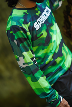 Load image into Gallery viewer, Woodland Ranger Men's Riding Jersey rear view showcasing the full green camouflage design while the rider explores a forest trail.