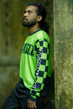 Load image into Gallery viewer, Green Vortex Riding Jersey sleeve detail featuring black and green checkered graphics with SPYNDELL branding.
