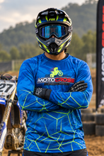 Load image into Gallery viewer, Luminous Matrix Men's Riding Jersey in blue with neon green geometric matrix graphics and SPYNDELL branding, worn by a motocross rider.
