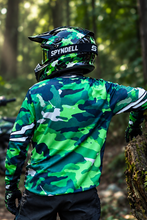Load image into Gallery viewer, Woodland Ranger Men's Riding Jersey back view featuring detailed green camouflage graphics, worn by a motorcycle rider on an off-road trail.
