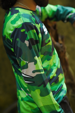 Load image into Gallery viewer, Close-up view of the Woodland Ranger Men's Riding Jersey showing its green camouflage fabric, sleeve detailing and comfortable riding fit.
